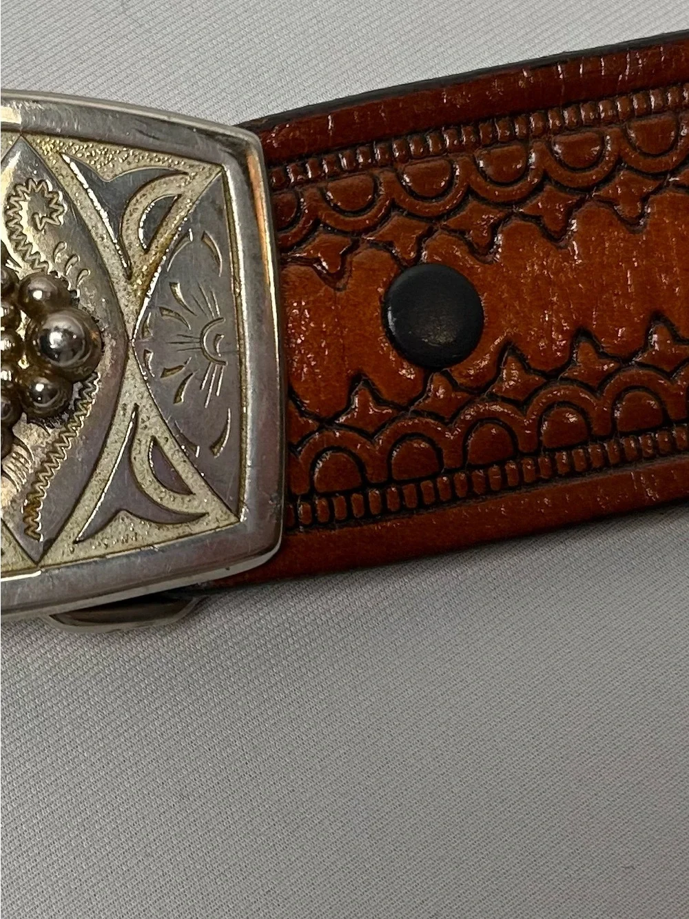 Embossed Brown Leather Western Belt with Decorative Silver-Tone Buckle